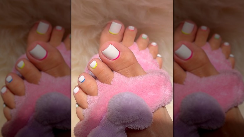 white pedicure with neon reverse french