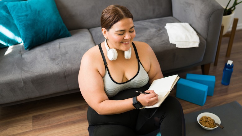 woman holding journal