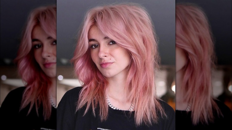 Woman with a wolfcut and curtain bangs