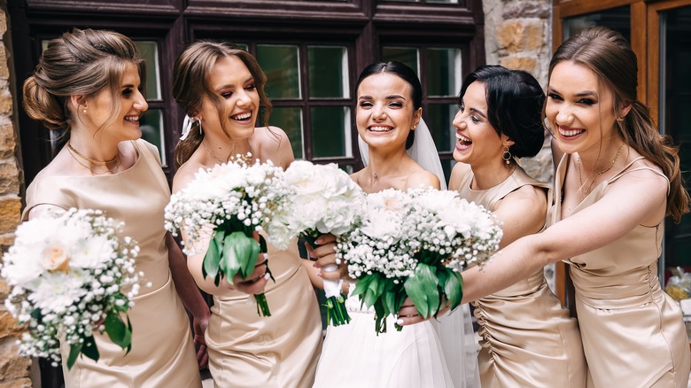 Bridesmaids posing with bride