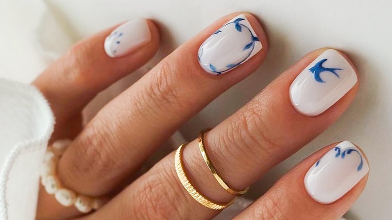 Close up of spring manicure in white and blue