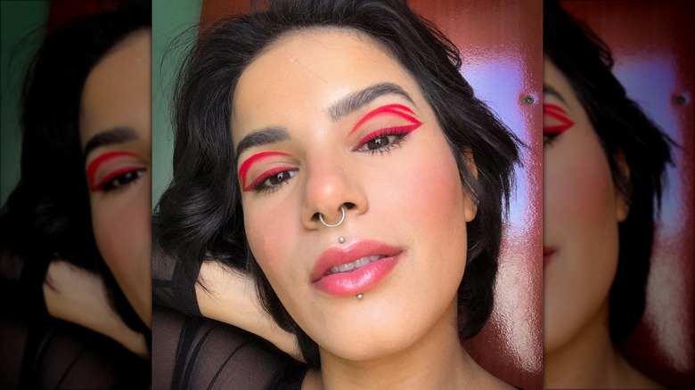 Person wearing red eyeliner