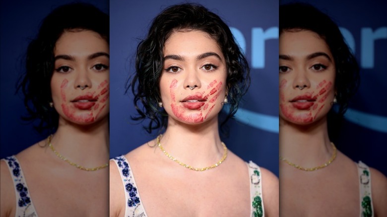 Auli'i Cravalho, red hand print