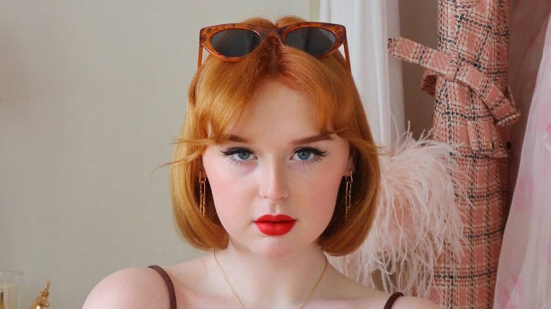 Woman with baby curtain bangs