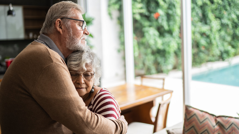 Senior couple hugging 