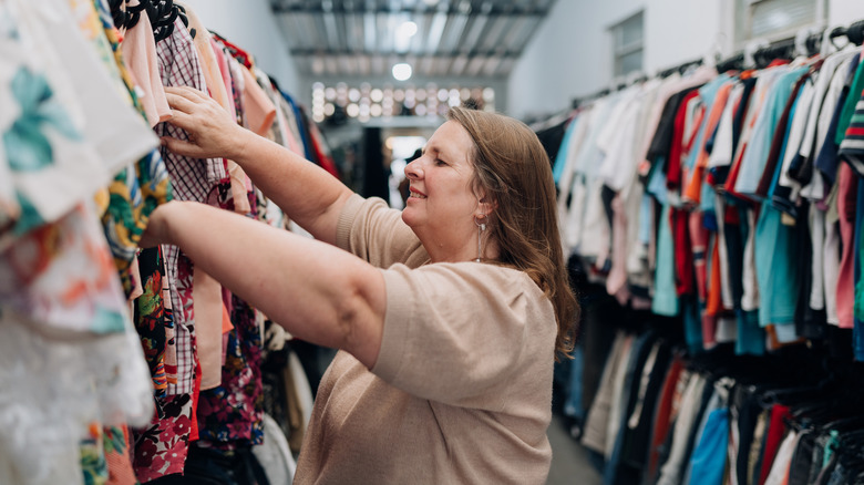 Woman clothes shopping in store