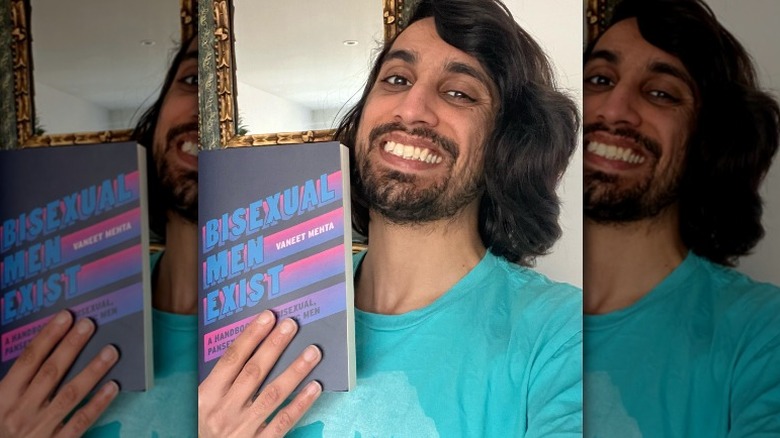 Vaneet Mehta holding his book