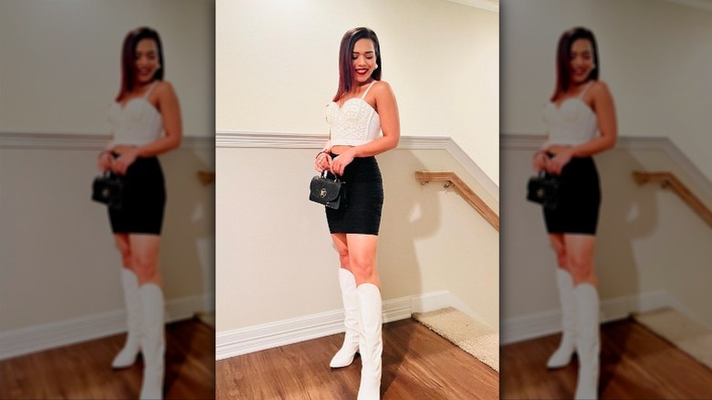 Woman in black and white outfit