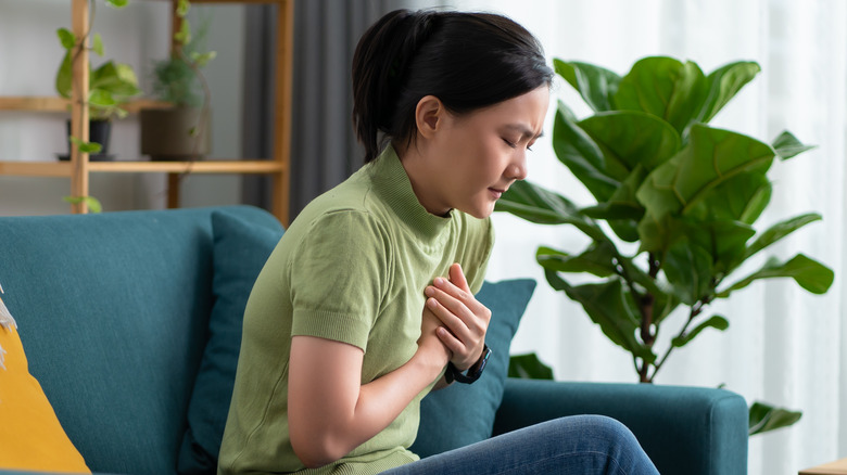 Woman holding breast