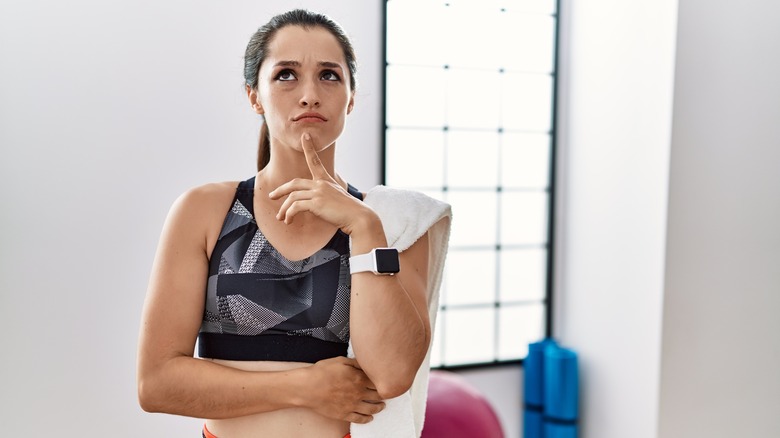 Woman thinking while at gym 