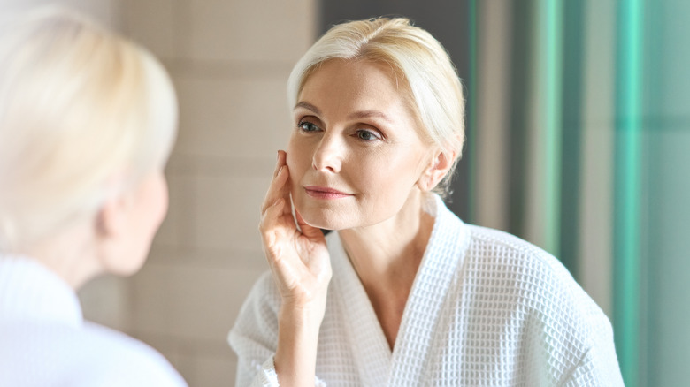 Woman touching her face