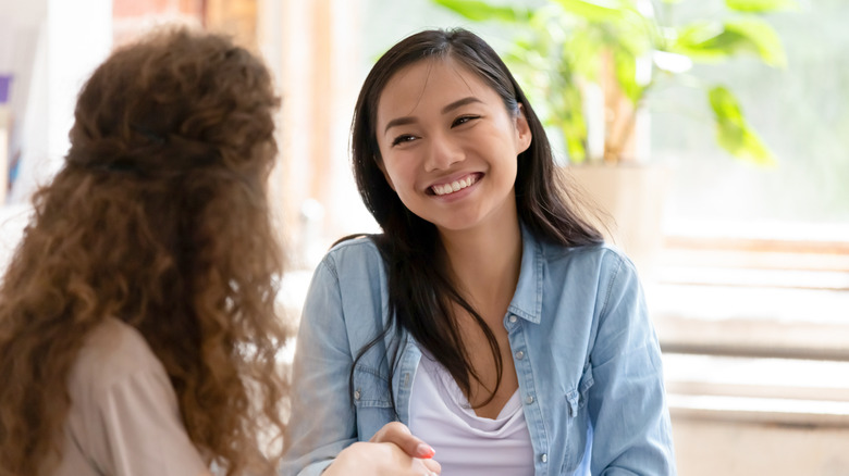 women smiling in a job interview