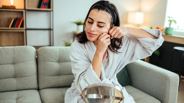 Woman massaging her face