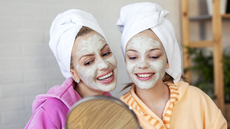 Two women wearing face masks