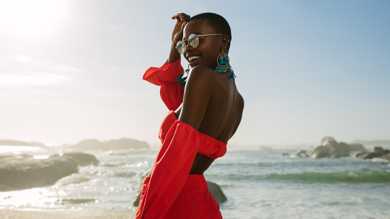 woman wearing red two piece set on vacation