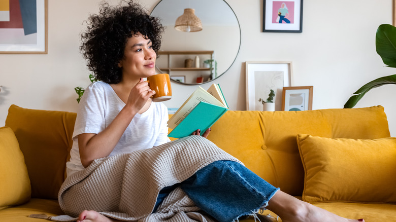 Woman reading on couch
