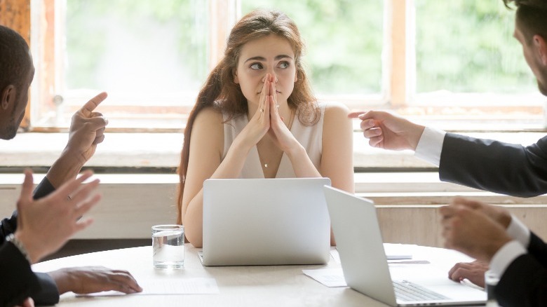 Woman being blamed at work