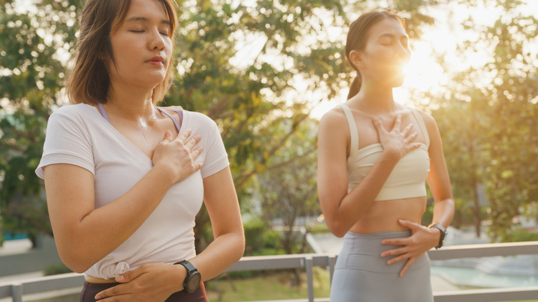 Women breathing deeply