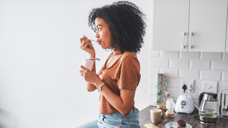 woman eating yogurt