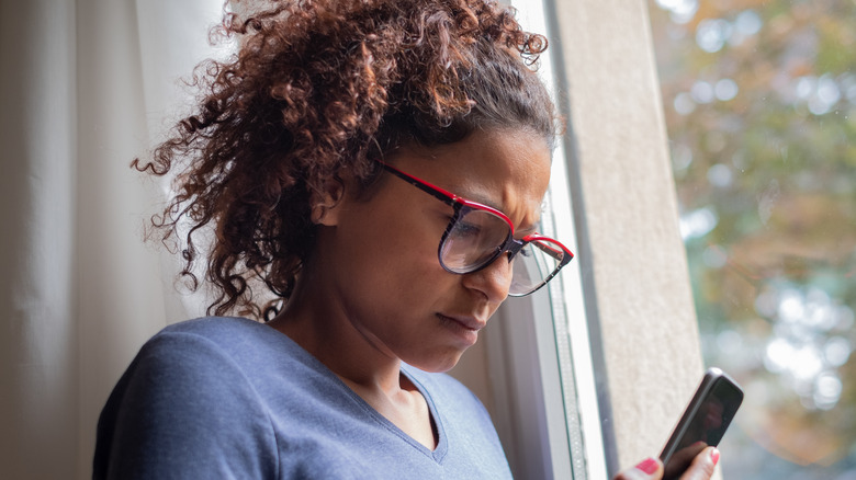 woman looking doubtful