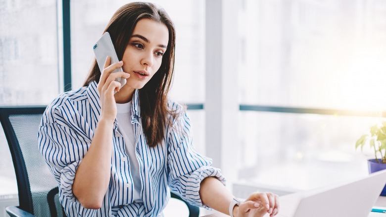 Woman on phone at desk