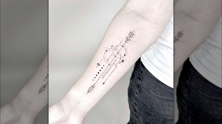 Coordinate with arrow and moon tattoo