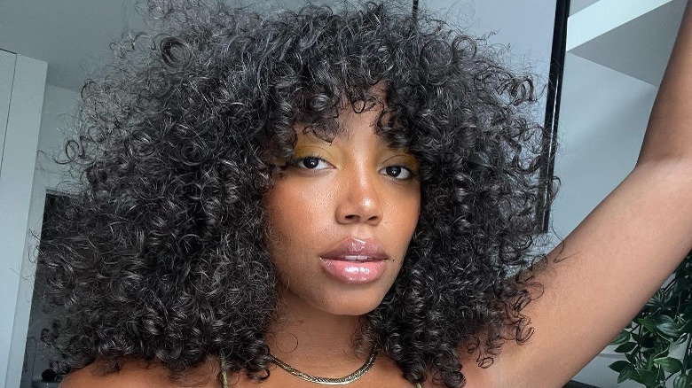 Brianna Wright with curly hair