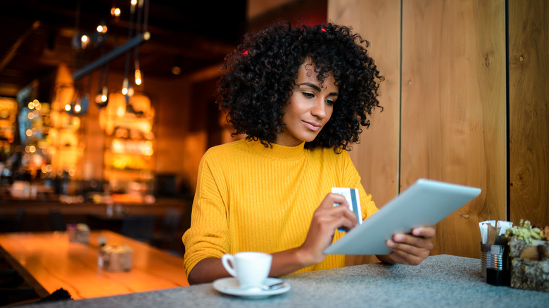 Woman holding her credit card 