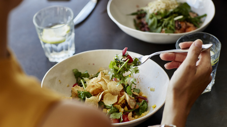 Woman eating salad