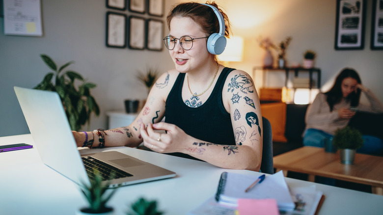 Tattooed person on zoom call 