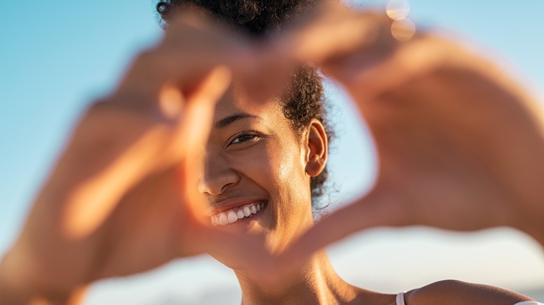 Woman making a heart with her hands