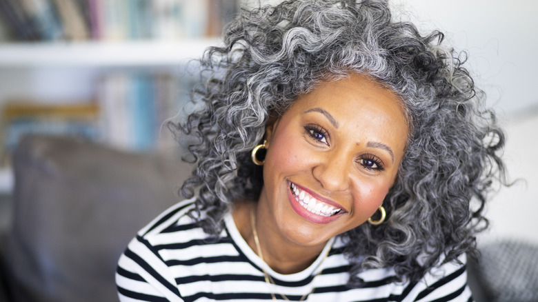 Smiling woman with gray hair
