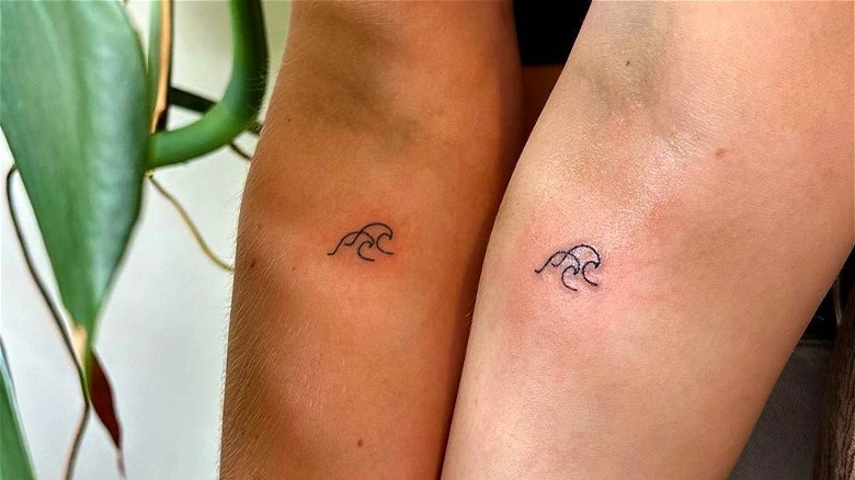 Matching wave tattoos