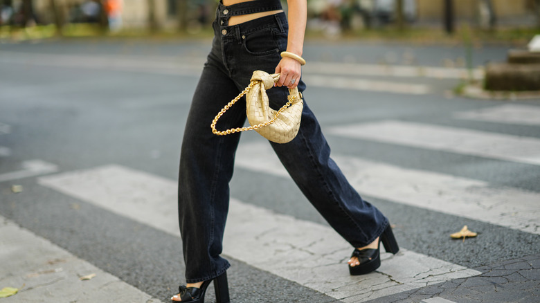 model walking a cross walk