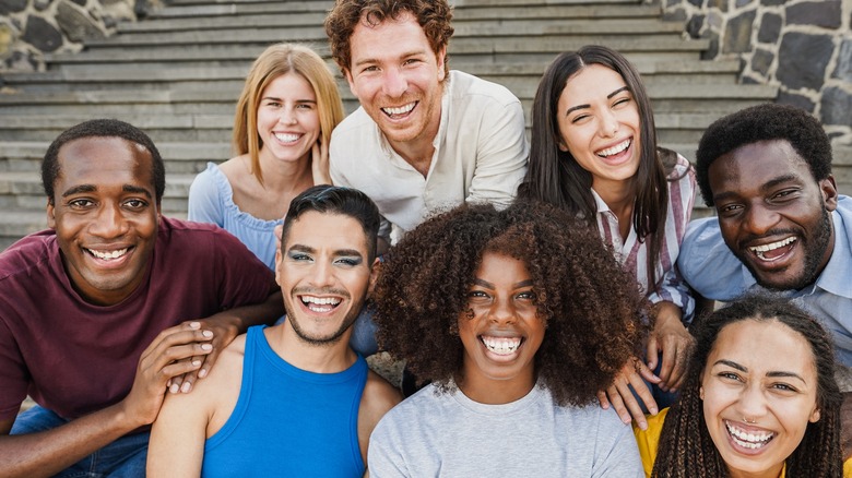 A group of people smiling