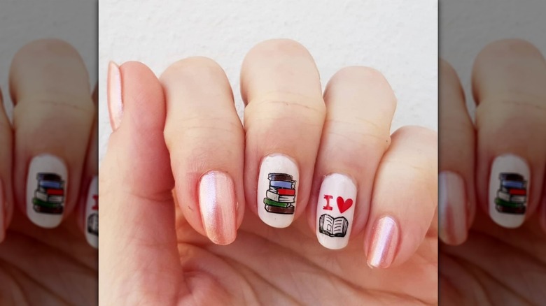 book-themed manicure in pink