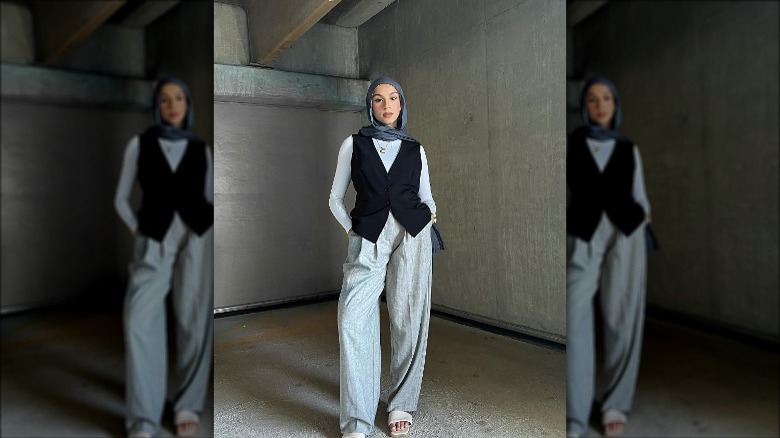 woman with black vest