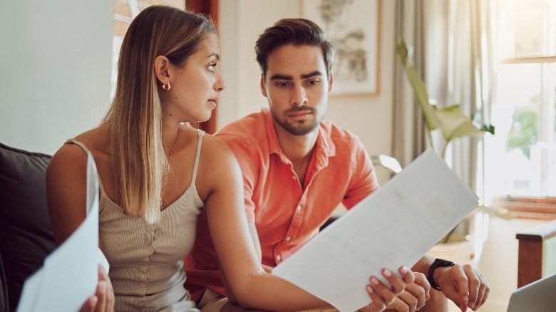 Couple talking about expenses