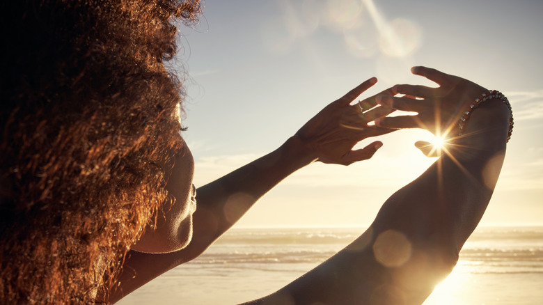 Woman looking at the sun