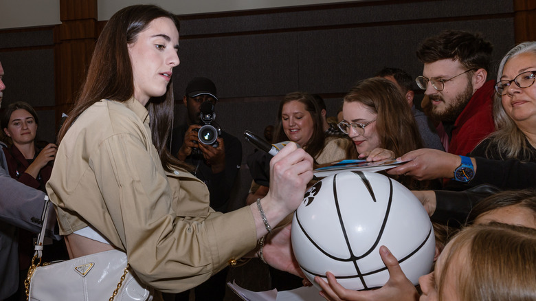 Caitlin Clark signing autographs