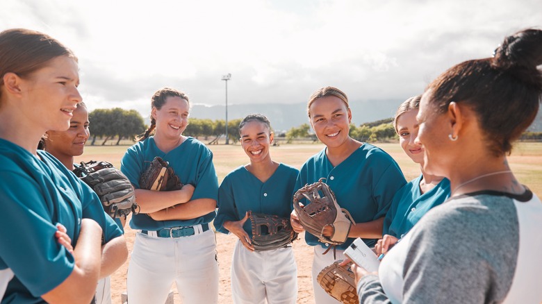 female softball team huddles