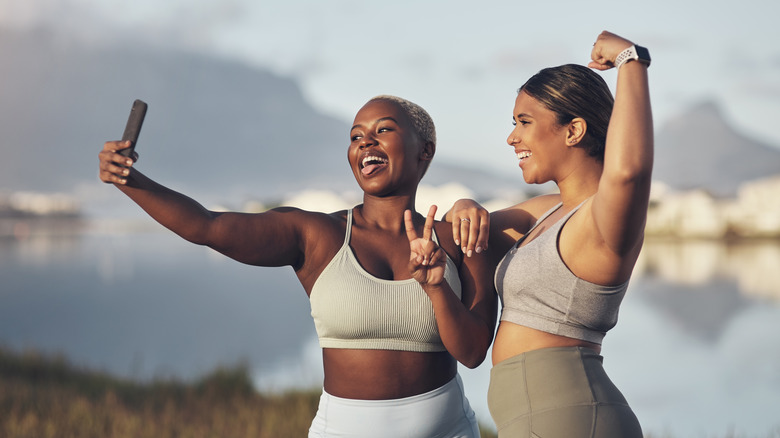 Workout buddies taking selfie