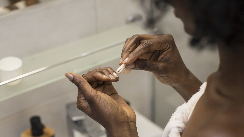 Woman removing polish