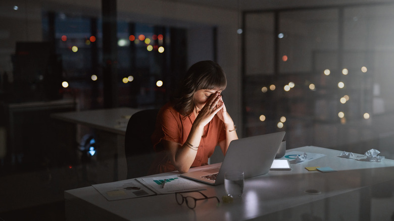 Upset woman on laptop