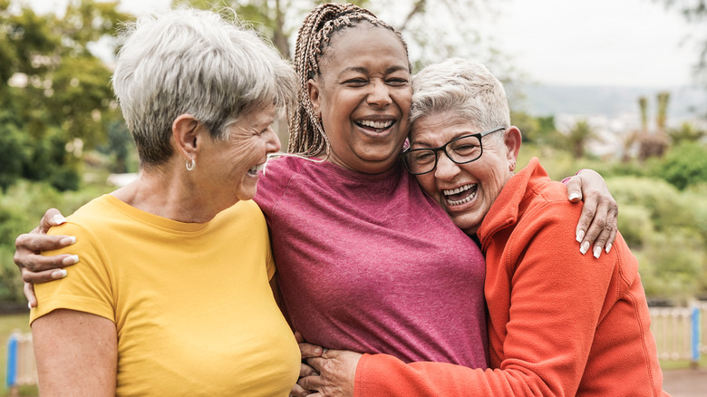 Middle-aged women embracing