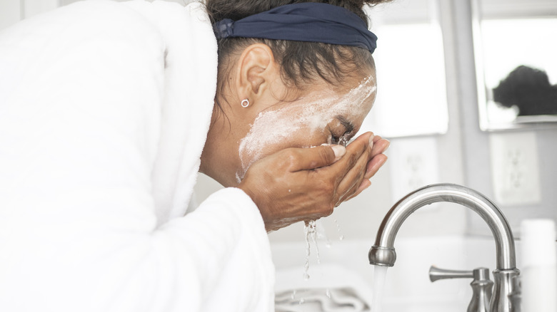 Woman washing face