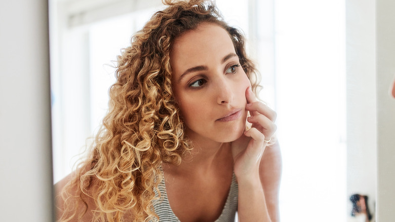 Woman looking in the mirror