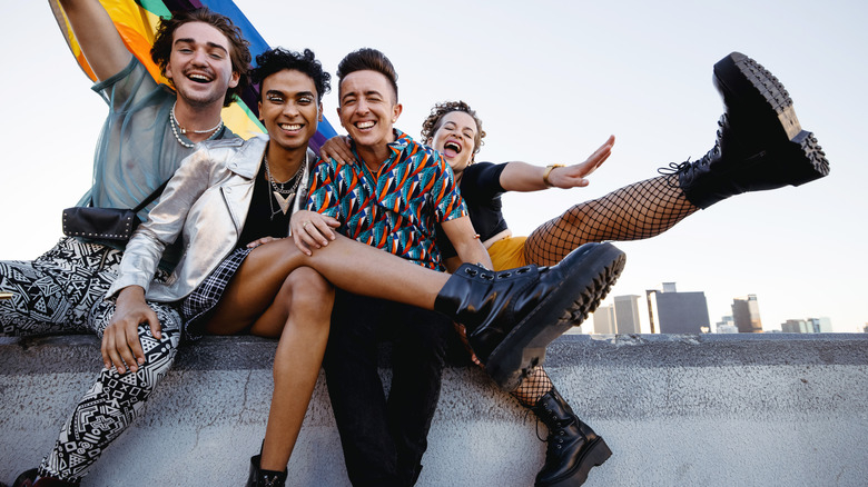 four friends celebrate pride