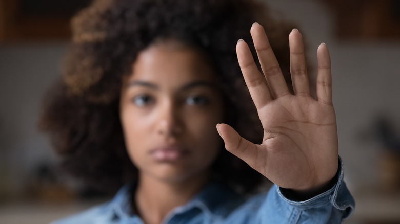 Woman holding up her hand