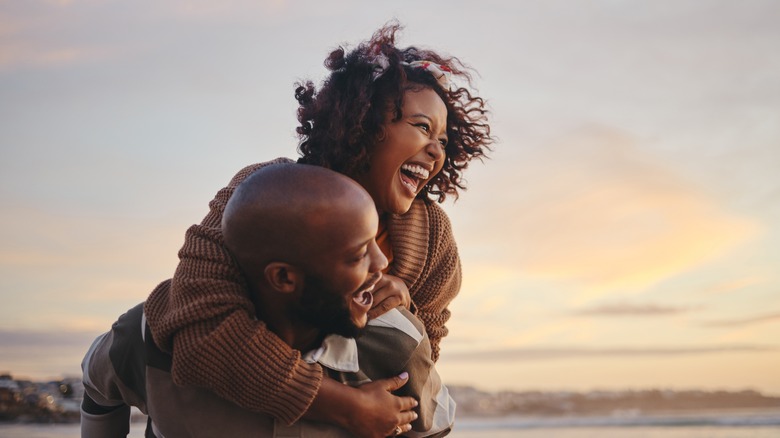 straight couple laughing